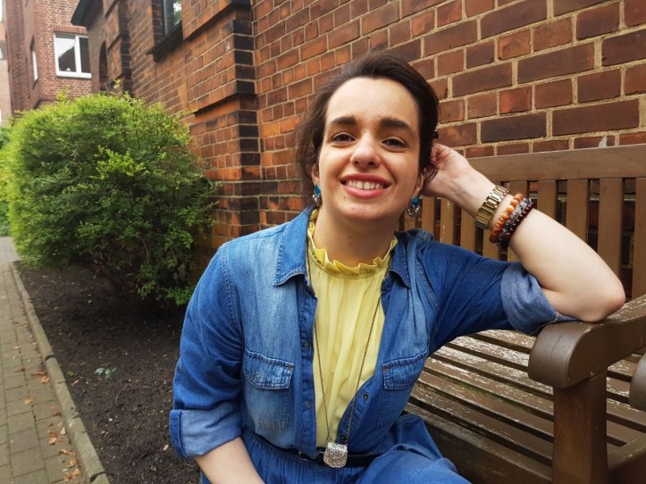 yellow on denim look smiling