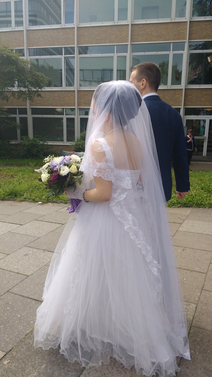 Bride and groom walking to the registry office