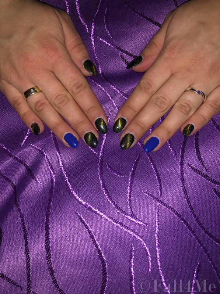 Starlight nails with one matte clear blue on the ring finger nail