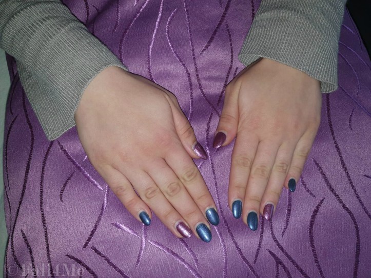 Metallic glittery nails in purple and magenta.