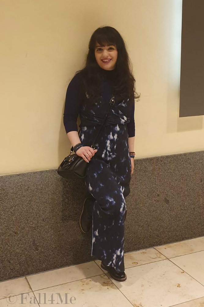 A maxi summer dress worn over a blue turtle neck. 