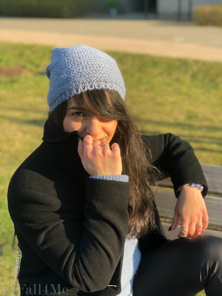 Steel-blue knit mixed with black leather and wool.