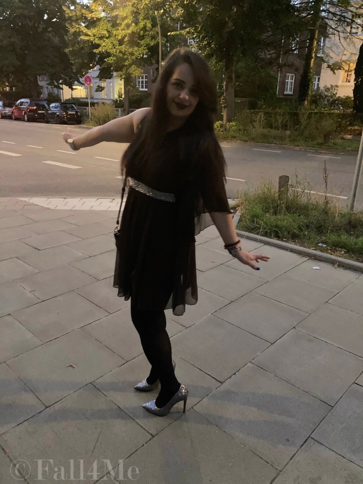 A brown asymmetric disco dress in chiffon combined with silver glitter.