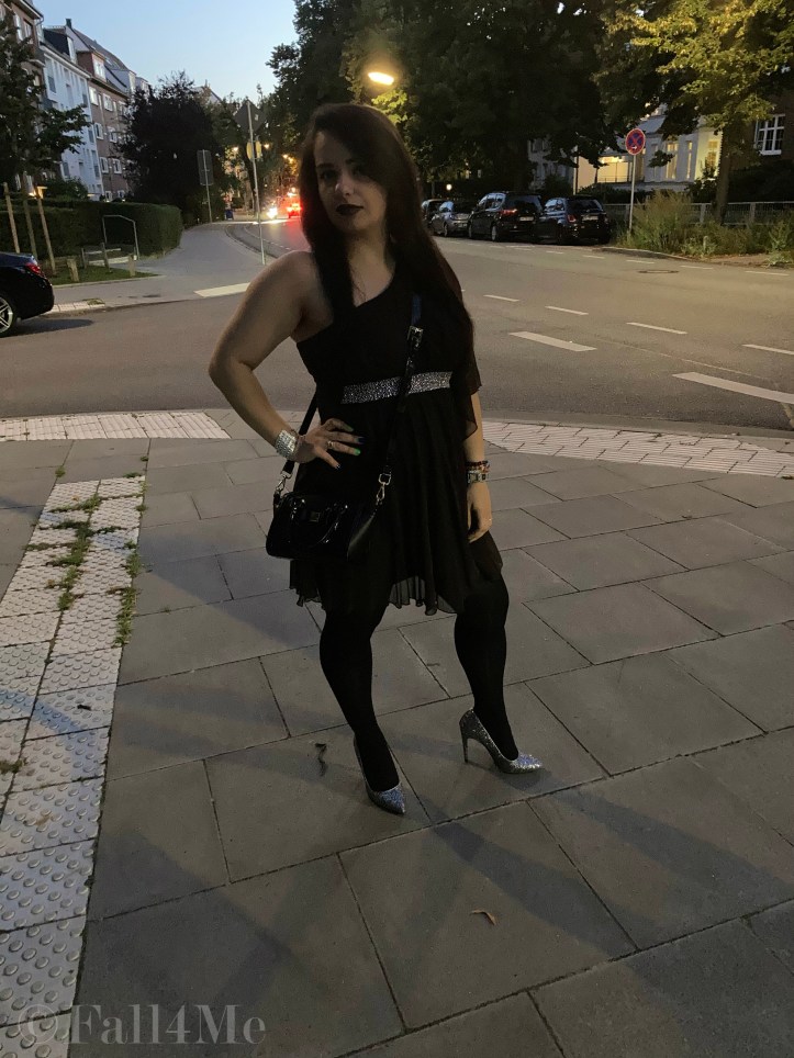 A brown asymmetric disco dress in chiffon combined with silver glitter.