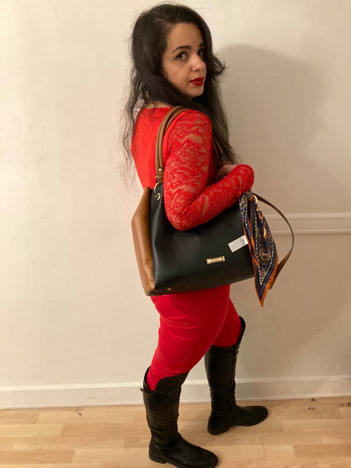 Red 100 per cent from head to toe with accessories in black (or white).