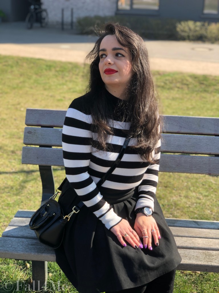 Black and white worn with a red accent.