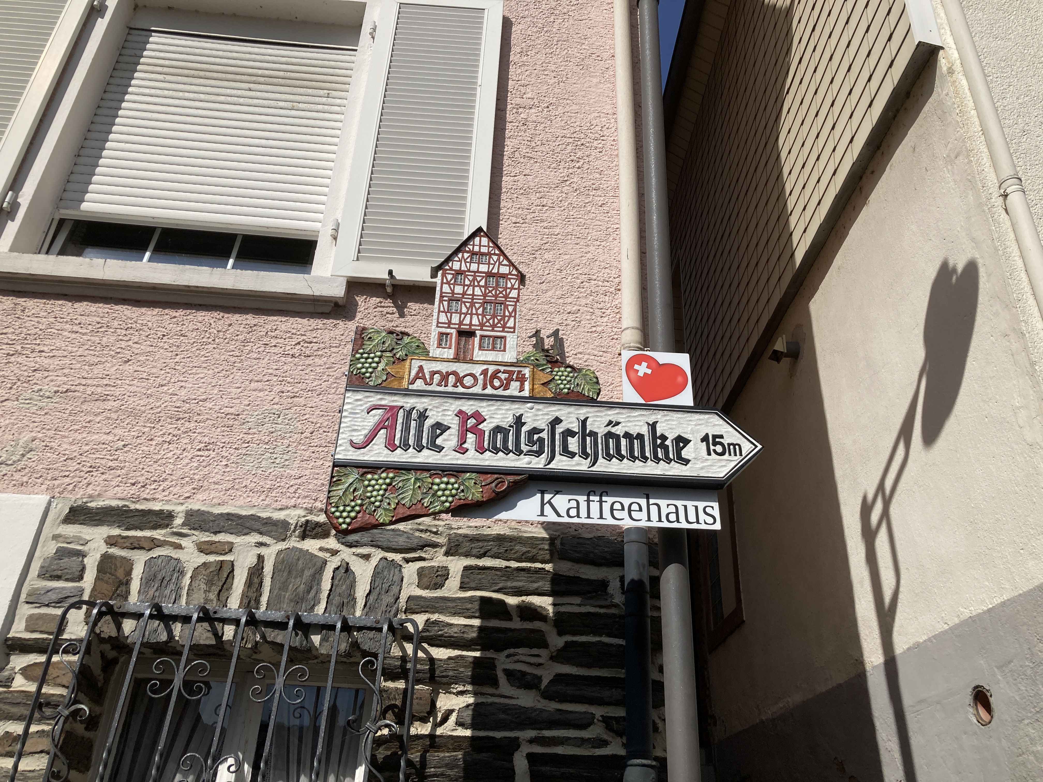 A shield showing where to find the bistro in the town hall.