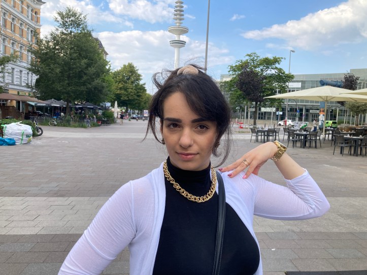 White combined with black contrasts and bold golden jewellery.