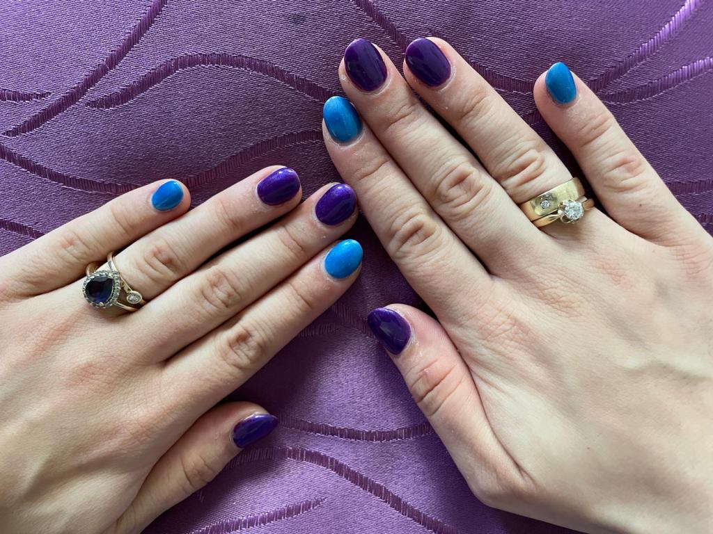 Nails in purple and cobalt blue.