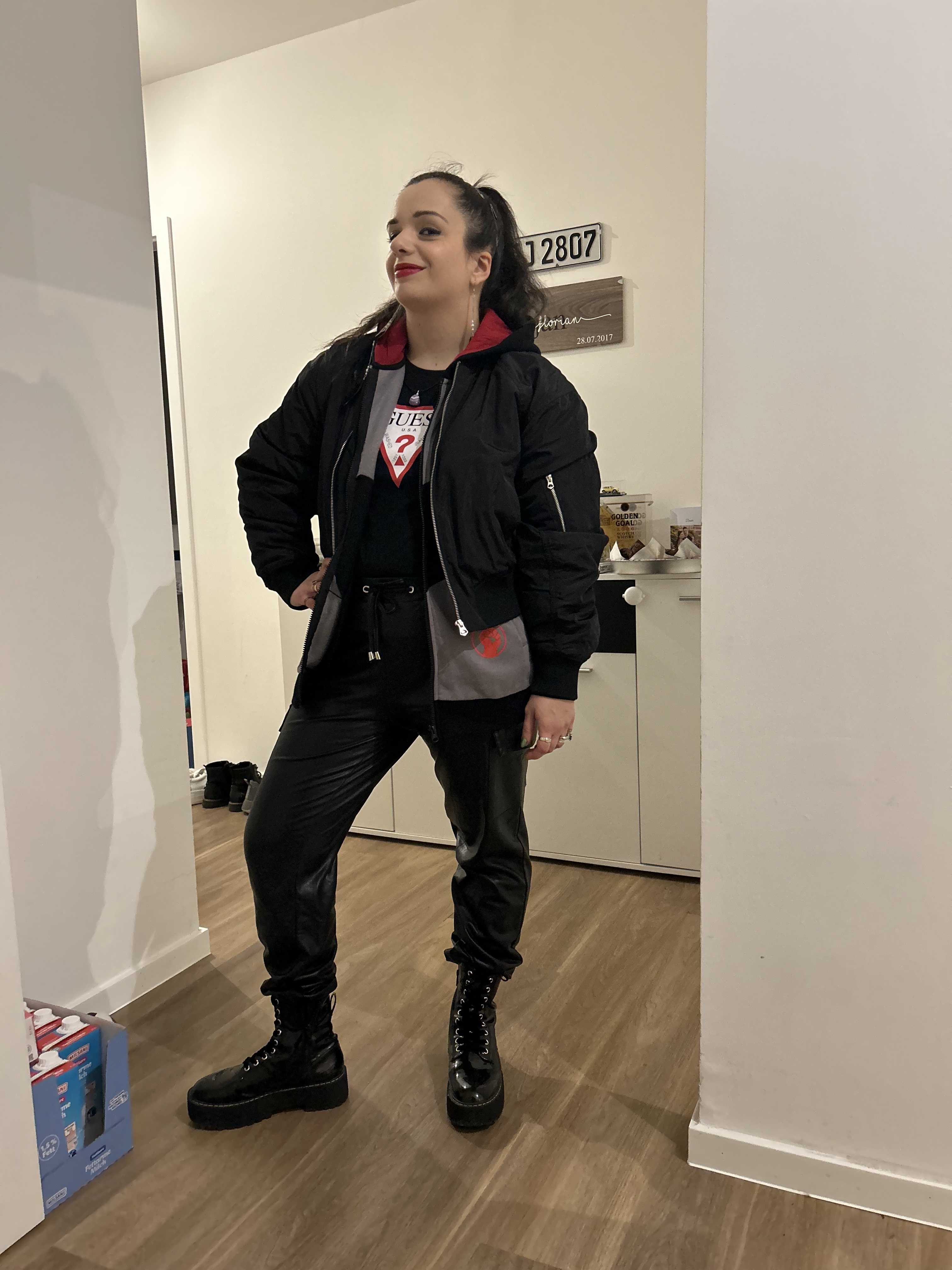 The trendy bomber jacket worn in a layer-look.