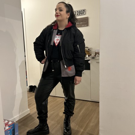 The trendy bomber jacket worn in a layer-look.