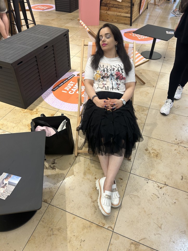 Upper Eastside chic with artful print t-shirt and a black tulle skirt.