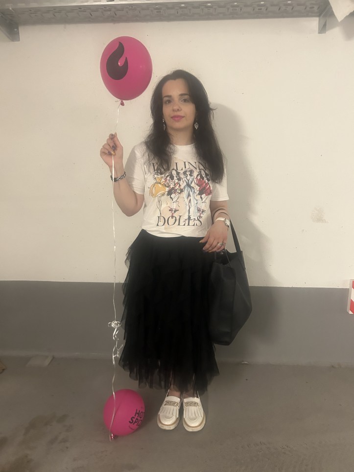 Upper Eastside chic with artful print t-shirt and a black tulle skirt.