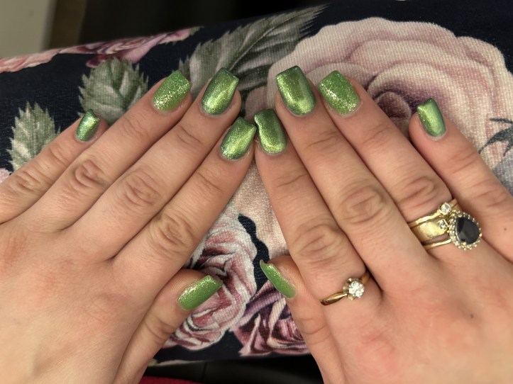Metallic and glitter nails in lime green.