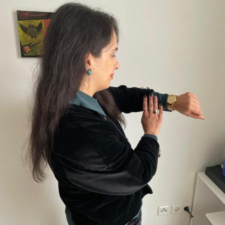 A construction set velvet suit in black with green contrast.