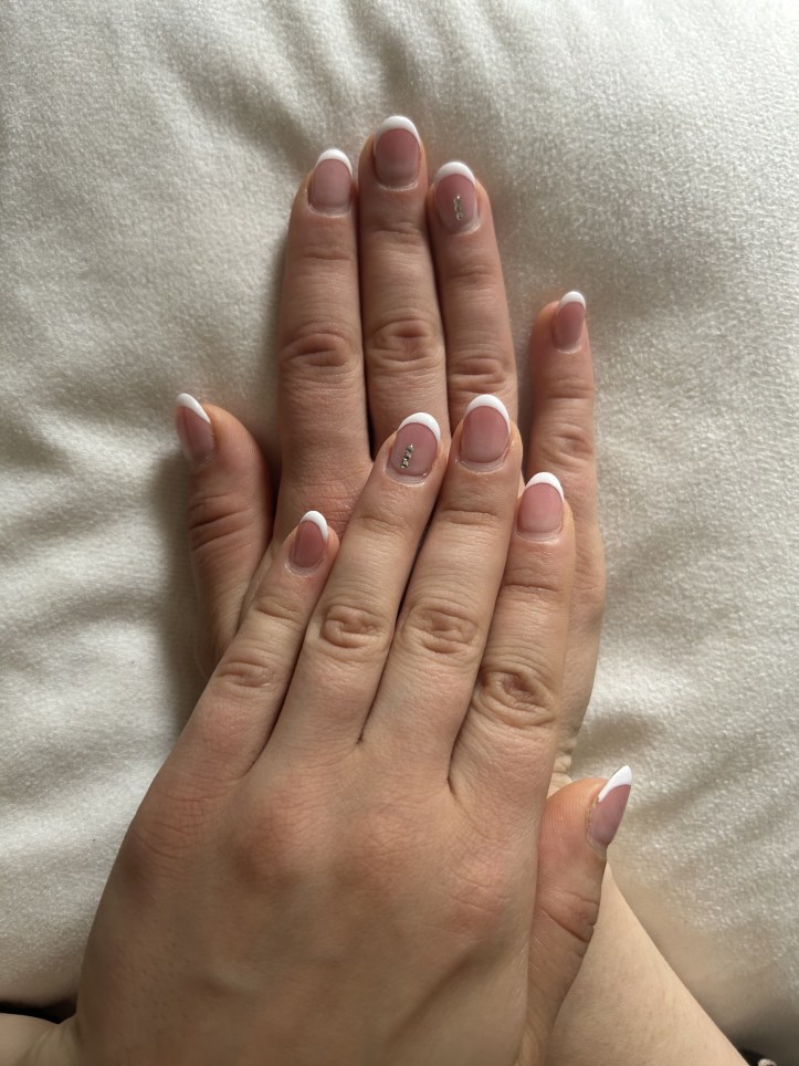 French nails with three stones on each ring-finger.