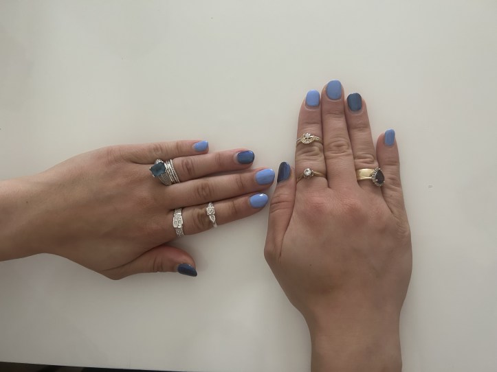 Nail art in dark blue and light blue.