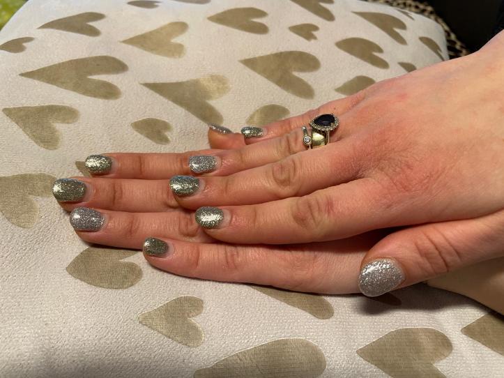 New Year's Eve nails in glittery silver and gold.