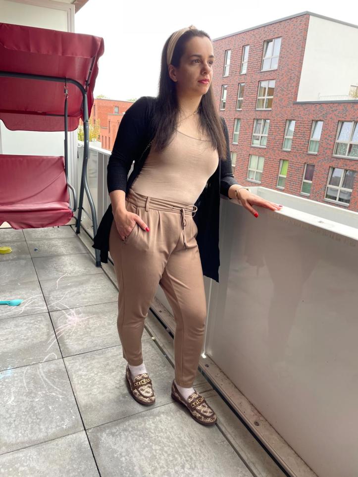 Reduction seduction in beige with a black cardigan.