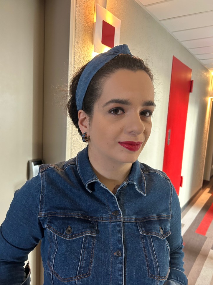 Denim all over with red accents.